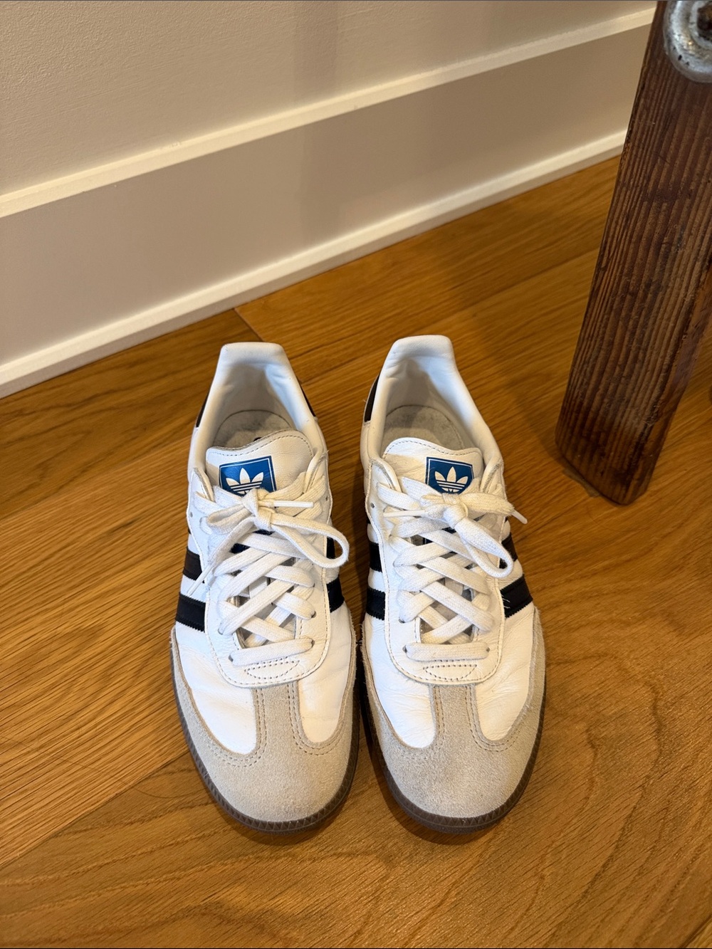adidas Women’s White Sneakers with Black Stripes and Blue Logo